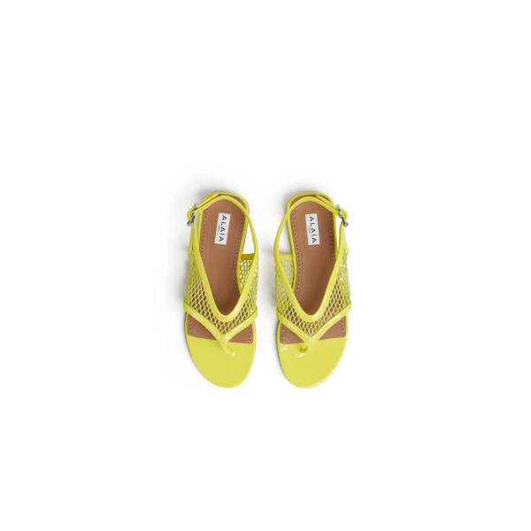 Alaia Fishnet Thong Sandals in Patent, Lemon Yellow | Sandals | Luxury Shoes 
