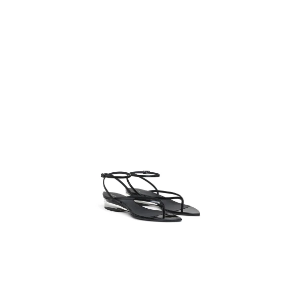 Alaia Invisible Thong in Patent Calfskin, Black | Sandals | Luxury Shoes 