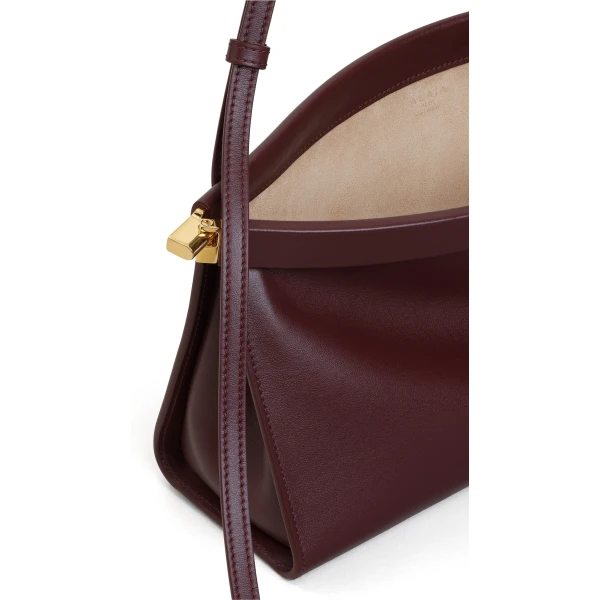 Alaia Le Click East West Medium Bag in Calfskin, Garnet Red | Shoulder & Crossbody Bags | Luxury Shoes 