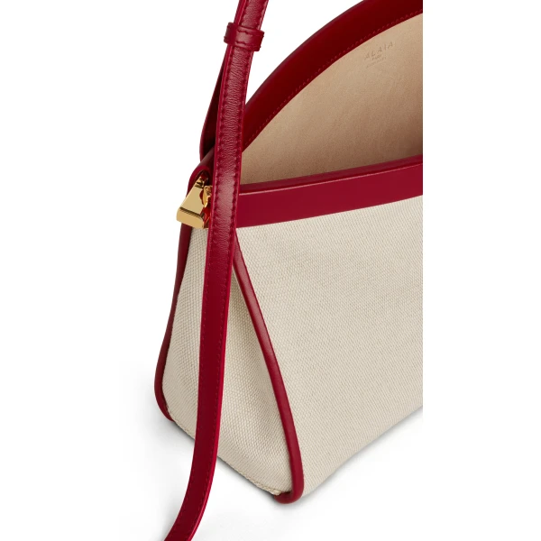 Alaia Le Click East West Medium Bag in Canvas, Natural and Red | Shoulder & Crossbody Bags | Luxury Shoes 
