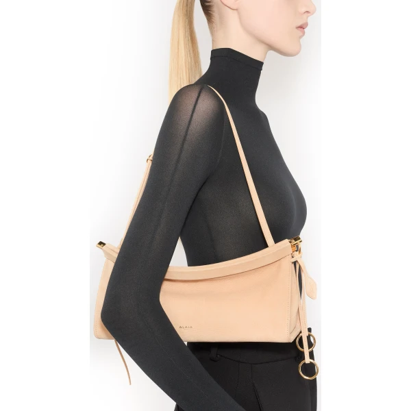 Alaia Le Click East West Medium Bag in Nubuck, Desert | Shoulder & Crossbody Bags | Luxury Shoes 