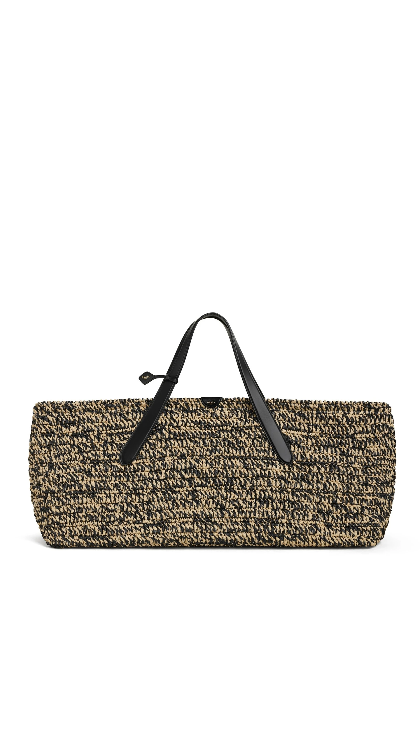 Alaia Le Panier East West Large Bag in Raffia, Natural and Black Alaia Le Panier East West Large Bag in Raffia, Natural and Black | Totes & Top-Handle Bags | Luxury Shoes