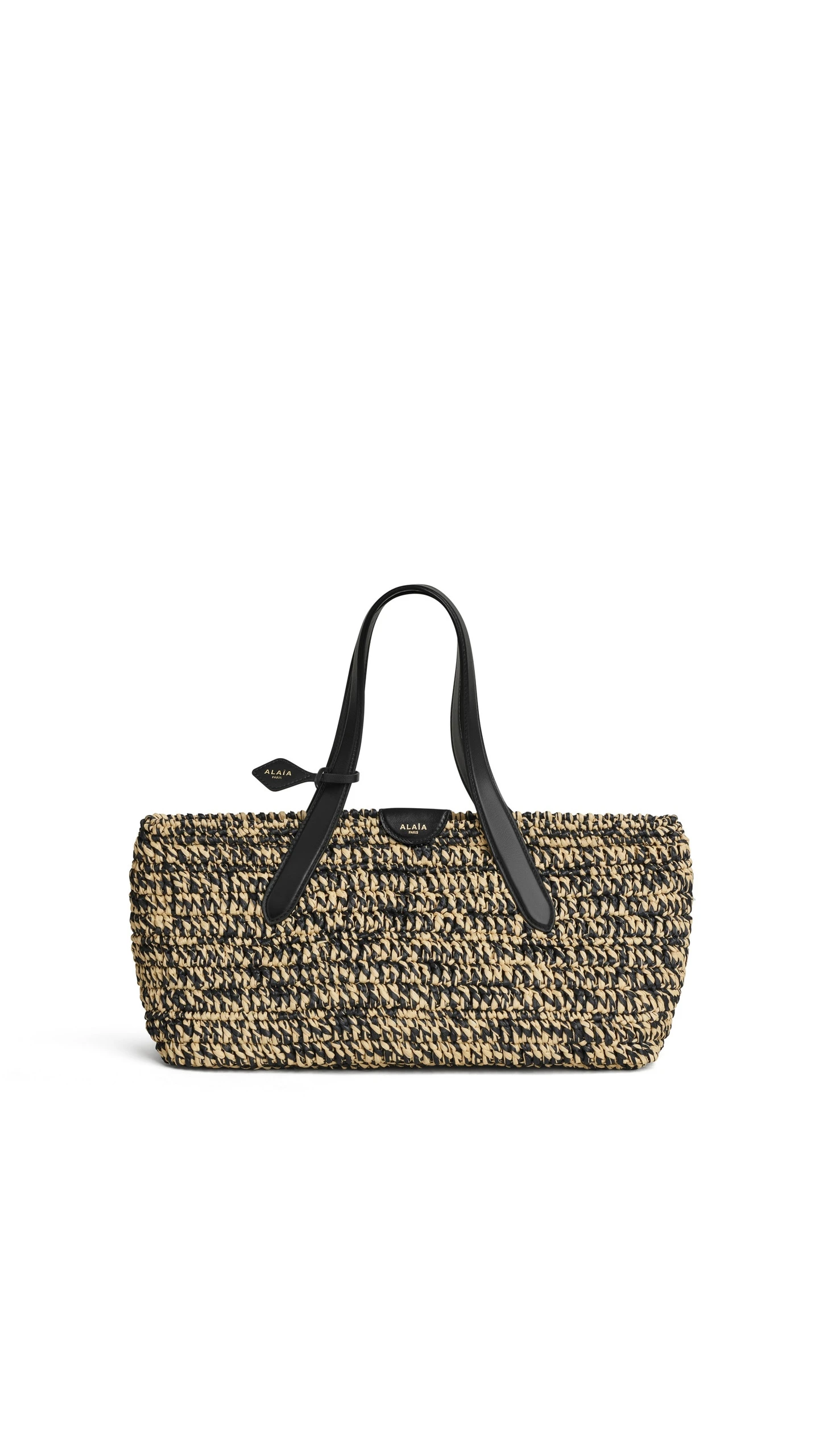 Alaia Le Panier East West Medium Bag in Raffia, Natural and Black Alaia Le Panier East West Medium Bag in Raffia, Natural and Black | Totes & Top-Handle Bags | Luxury Shoes