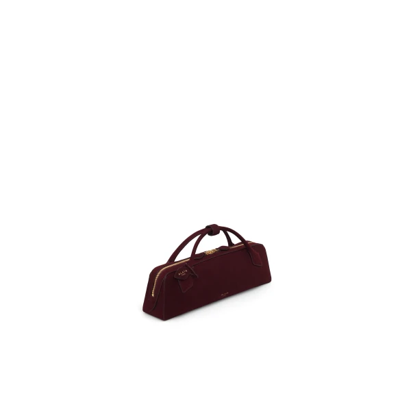 Alaia Le Teckel Clutch in Suede, Garnet Red | Clutch Bags | Luxury Shoes 