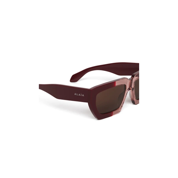 Alaia Melted Rectangular Sunglasses in Bordeaux | Sunglasses | Luxury Shoes 
