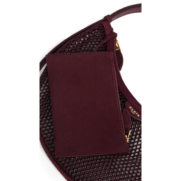 Alaia One Piece Demi Lune Bag in Fishnet and Suede, Garnet Red | Shoulder & Crossbody Bags | Luxury Shoes 