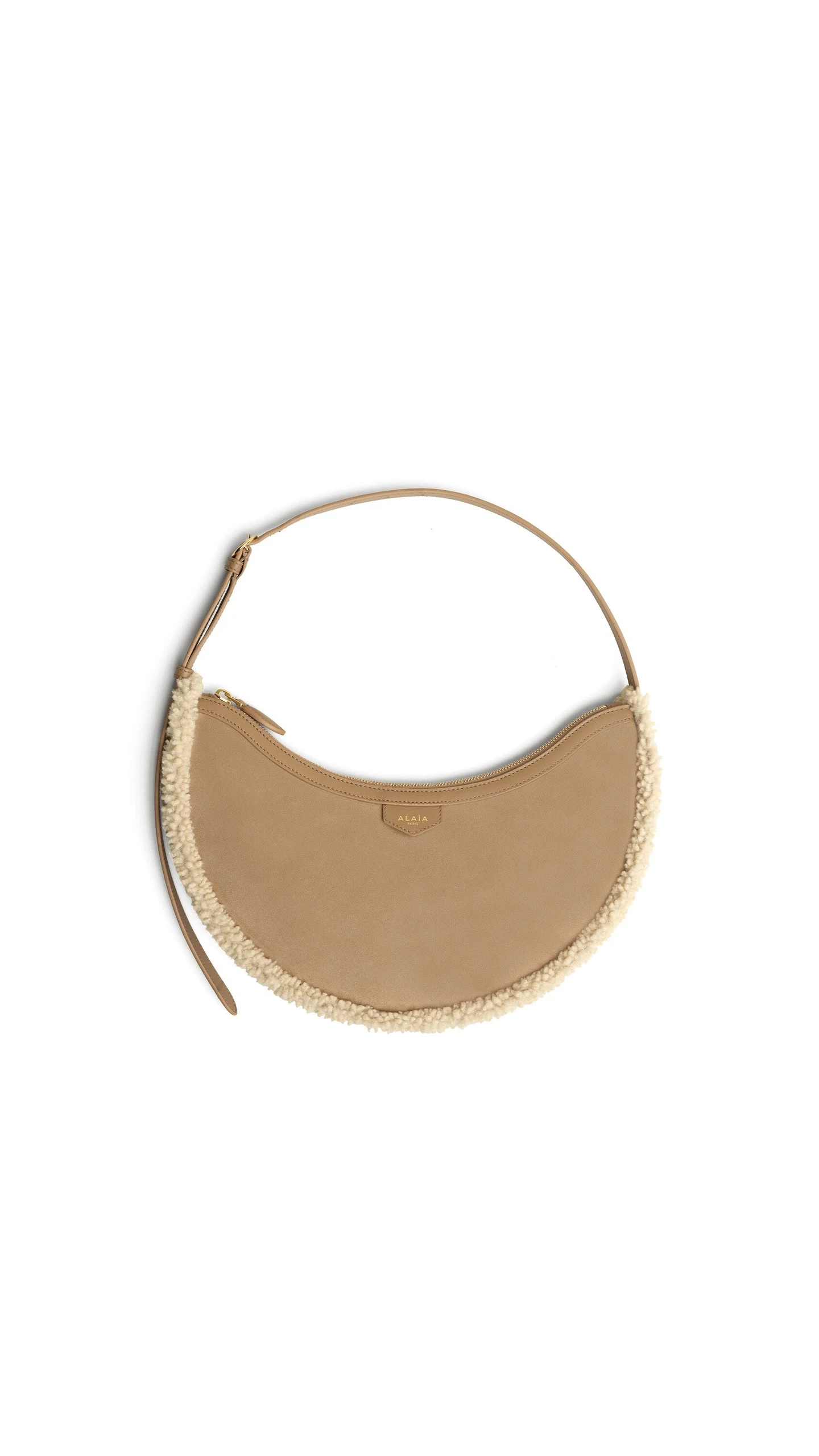 Alaia One Piece Demi Lune Bag in Merino Shearling, Camel Alaia One Piece Demi Lune Bag in Merino Shearling, Camel | Shoulder & Crossbody Bags | Luxury Shoes