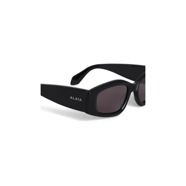 Alaia Oval Sunglasses in Black | Sunglasses | Luxury Shoes 