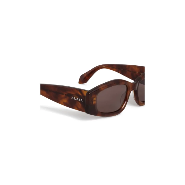 Alaia Oval Sunglasses in Dark Havana | Sunglasses | Luxury Shoes 