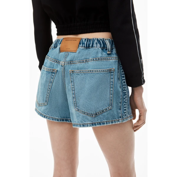 Alexander Wang Balloon Logo-Embossed Denim Marathon Short in Vintage Light Indigo | Denim Shorts | Luxury Shoes 