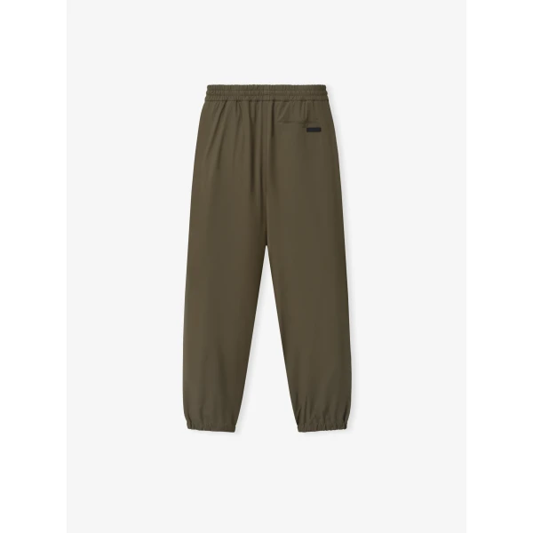 Fear of God Bonded Nylon Tech Track Pants in Forest | Pants | Luxury Shoes 