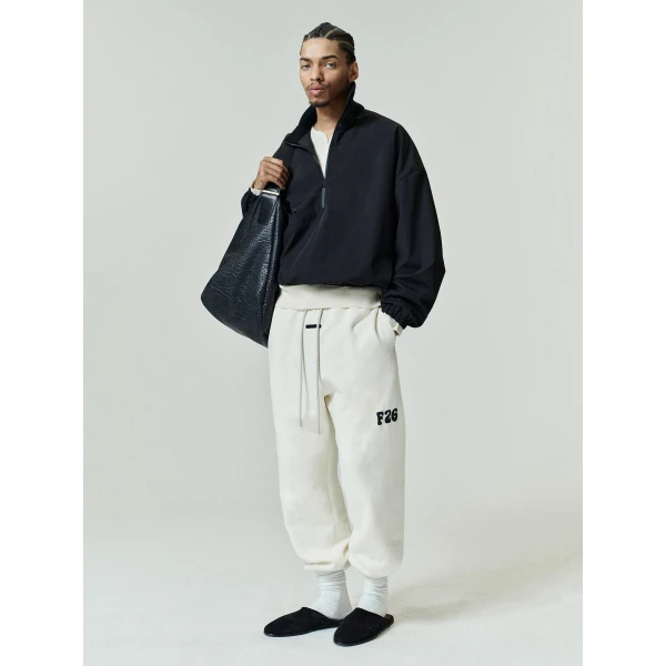 Fear of God Essentials Classic Fleece Sweatpant in Washed Ivory | Pants | Luxury Shoes 