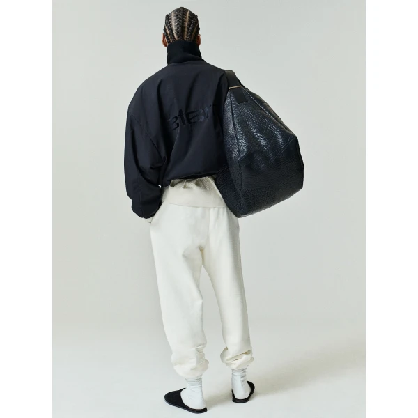 Fear of God Essentials Classic Fleece Sweatpant in Washed Ivory | Pants | Luxury Shoes 