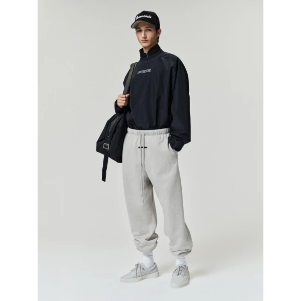 Fear of God Essentials Classic Slouchy Sweatpant in Pyrite Heather | Pants | Luxury Shoes 