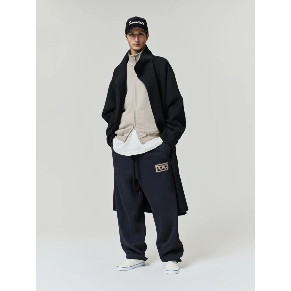 Fear of God Essentials Classic Slouchy Sweatpant in Washed Vintage Black | Pants | Luxury Shoes 