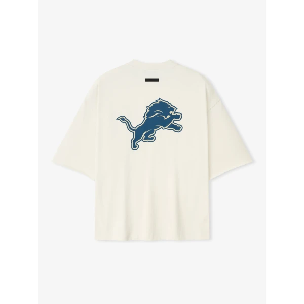 Fear of God Essentials Lions 90s 3/4 Sleeve Football Tee in Cream White | T-shirts & vests | Luxury Shoes 
