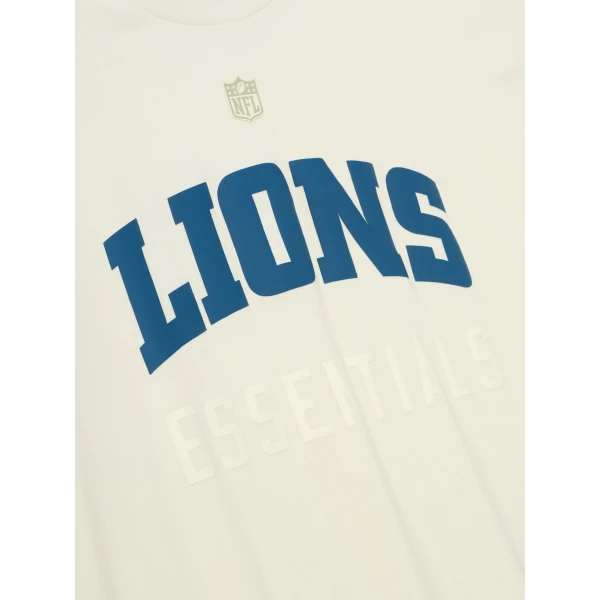 Fear of God Essentials Lions 90s 3/4 Sleeve Football Tee in Cream White | T-shirts & vests | Luxury Shoes 