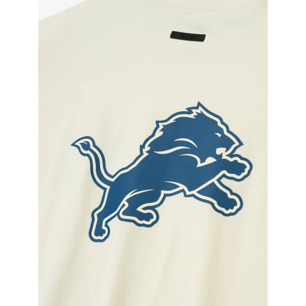 Fear of God Essentials Lions 90s 3/4 Sleeve Football Tee in Cream White | T-shirts & vests | Luxury Shoes 