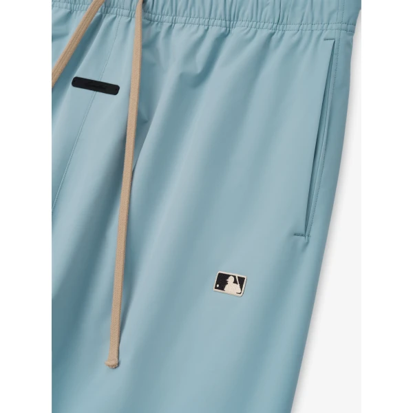 Fear of God Essentials MLB Relaxed Track Pant in Stone Blue | Pants | Luxury Shoes 