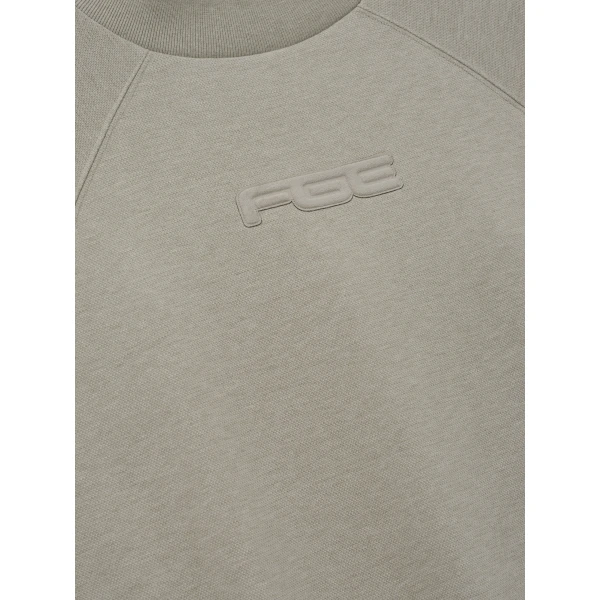 Fear of God Essentials Pique 90s Relaxed Mockneck Raglan Long Sleeve Tee in Pyrite Heather | T-shirts & vests | Luxury Shoes 