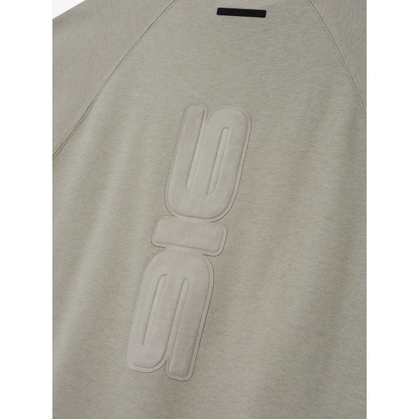 Fear of God Essentials Pique 90s Relaxed Mockneck Raglan Long Sleeve Tee in Pyrite Heather | T-shirts & vests | Luxury Shoes 