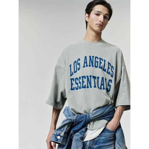 Fear of God Essentials Rams Merch Tee in Seal Heather | T-shirts & vests | Luxury Shoes 