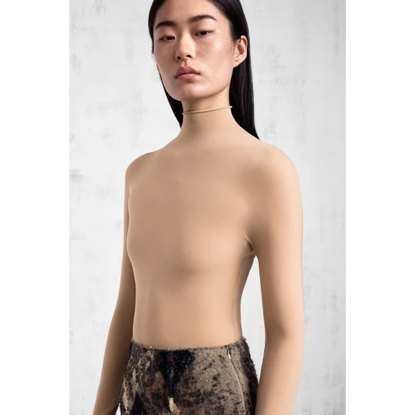 Maison Margiela Technical Jersey Turtleneck Bodysuit in Nude | Bodysuit | Luxury Shoes 