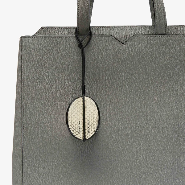 Valextra Golf Ball Charm in Pergamena White and Black | Bag charms | Luxury Shoes 